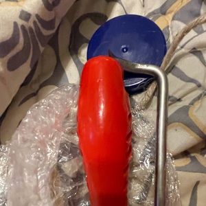 “Pigtail” flipper for meats.